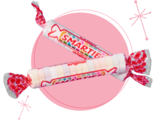 Smarties roll on pink circle.